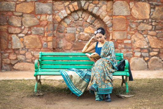 Modal silk saree with heavy Zari Pallu (Dull black saree with Blue & orange colour patterns)